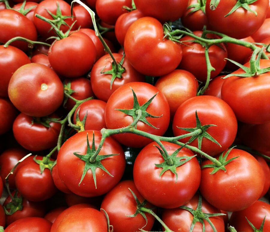 red tomatoes on brown wooden table