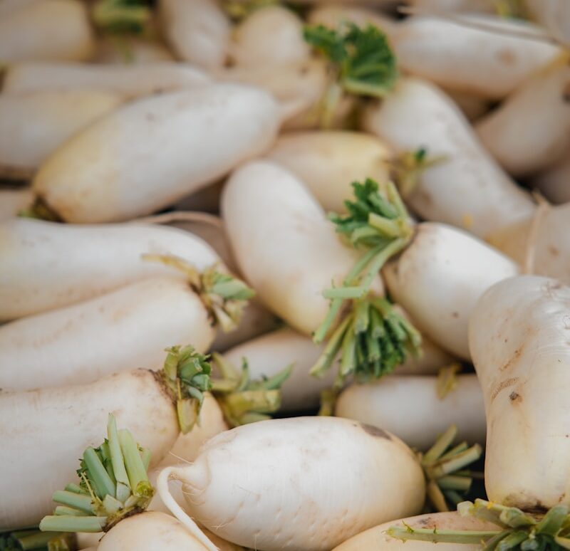 white garlic on brown wooden table